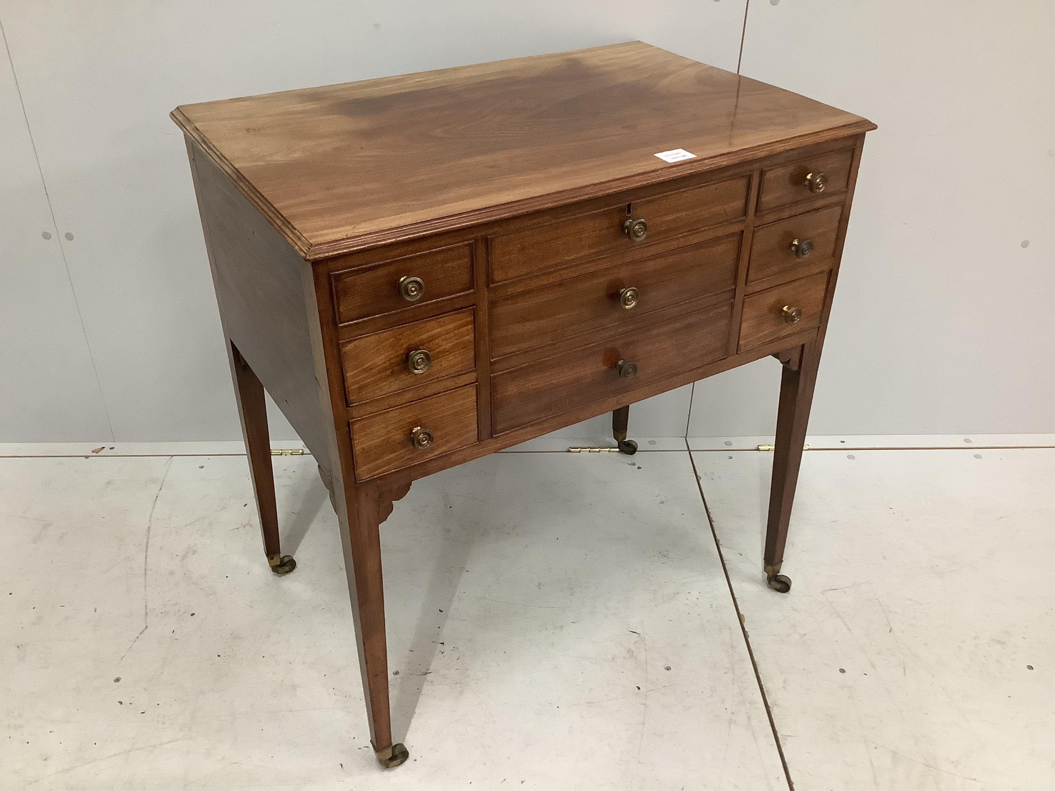 A late George III mahogany enclosed dressing table, with a lift up top, over drawers, width 78cm, depth 50cm, height 83cm. Condition - fair